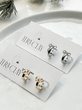 Load image into Gallery viewer, The Bow Huggie Hoops (also in silver)