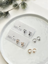 Load image into Gallery viewer, The Bow Huggie Hoops (also in silver)