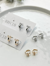 Load image into Gallery viewer, The Bow Huggie Hoops (also in silver)