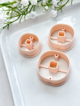 Load image into Gallery viewer, Rounded Square Donut with Drill Guides Polymer Clay Cutter