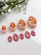Load image into Gallery viewer, Oval Donut with Drill Guides Polymer Clay Cutter PCC1855
